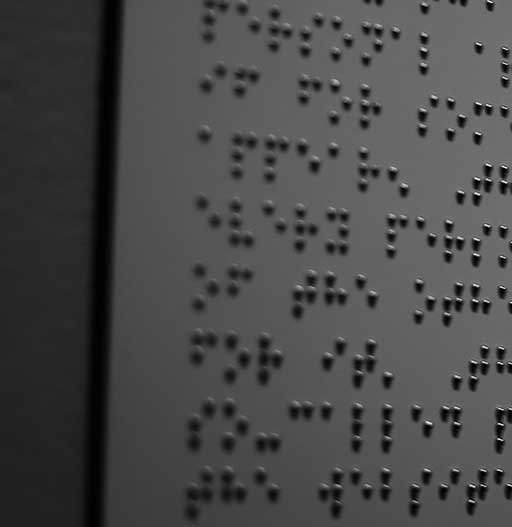 Image of a wallpanel written in Braile.